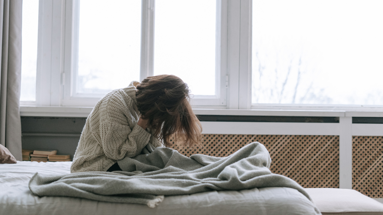 A Woman Sitting On A Bed (1)